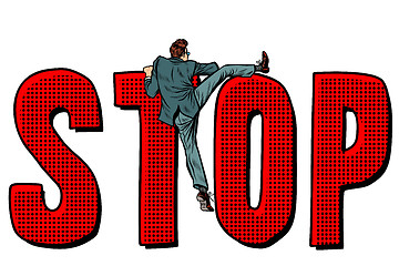 Image showing businessman man climbs on the word stop