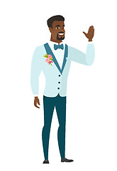 Image showing Young african-american groom waving his hand.