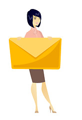 Image showing Smiling business woman holding a big envelope.