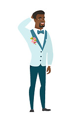 Image showing African-american groom holding hand behind head.