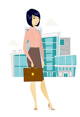 Image showing Asian business woman holding briefcase.