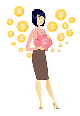 Image showing Asian business woman holding a piggy bank.
