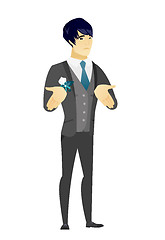 Image showing Asian confused groom shrugging shoulders