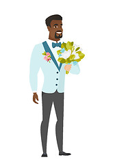 Image showing Young caucasian groom with a bridal bouquet.