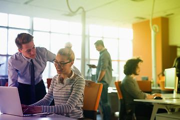 Image showing Two Business People Working With laptop in office