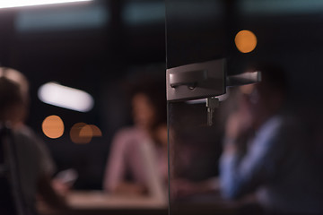 Image showing Multiethnic startup business team in night office