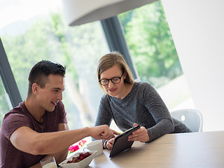 Image showing couple enjoying morning coffee and strawberries