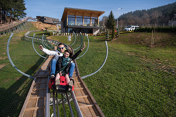 Image showing couple enjoys driving on alpine coaster