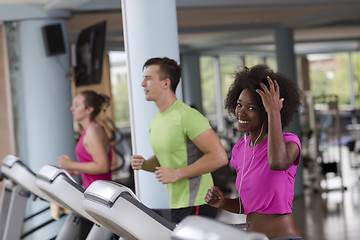 Image showing people exercisinng a cardio on treadmill in gym