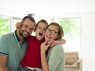 Image showing family with little boy enjoys in the modern living room