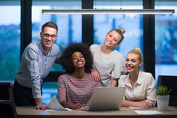 Image showing Multiethnic startup business team in night office