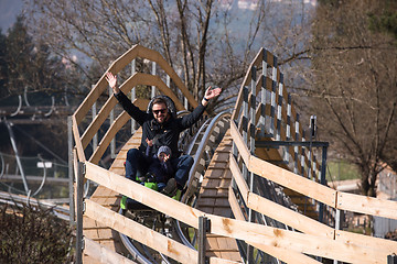 Image showing father and son enjoys driving on alpine coaster