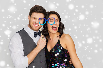 Image showing happy couple with party props having fun