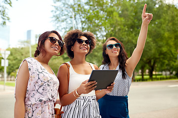 Image showing women with tablet pc on street in summer