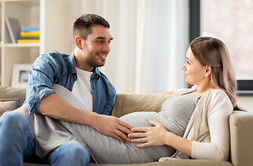 Image showing happy man with pregnant woman at home