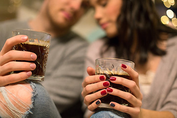 Image showing close up of happy couple drinking coffee at home