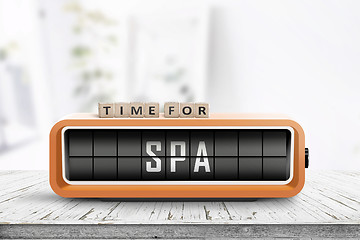 Image showing Time for spa message on a colorful alarm clock