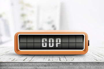 Image showing GDP announcement on a retro device in a bright office