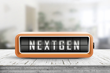 Image showing Nextgen word on an alarm device in orange color