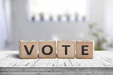 Image showing Vote sign made of wood in a bright room