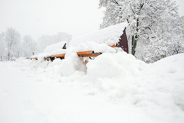 Image showing Park with Bench covered with Snow