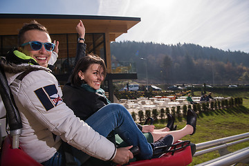 Image showing couple enjoys driving on alpine coaster