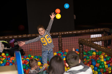 Image showing young parents with kids in a children\'s playroom