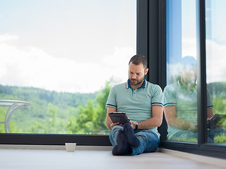 Image showing man on the floor enjoying relaxing lifestyle