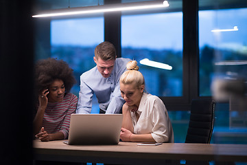 Image showing Multiethnic startup business team in night office