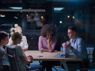 Image showing Multiethnic startup business team in night office