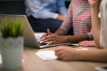 Image showing Multiethnic startup business team in night office