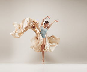 Image showing Modern ballet dancer dancing in full body on white studio background.