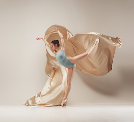 Image showing Modern ballet dancer dancing in full body on white studio background.