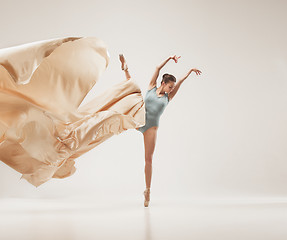 Image showing Modern ballet dancer dancing in full body on white studio background.