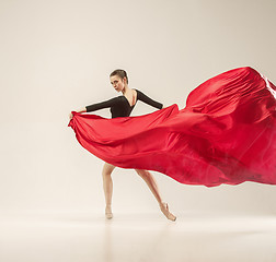 Image showing Modern ballet dancer dancing in full body on white studio background.