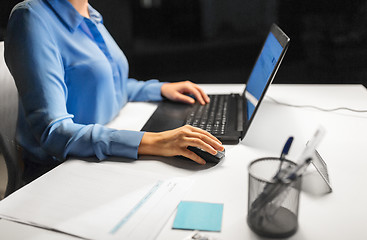 Image showing close up of businesswoman using computer mouse