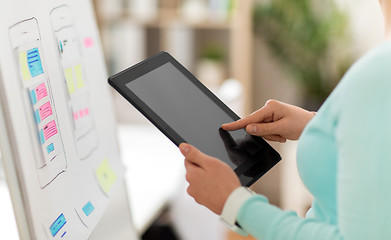 Image showing close up of ui designer with tablet pc at office