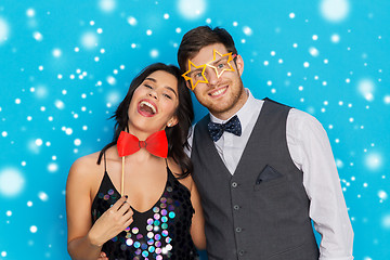 Image showing happy couple with party props having fun