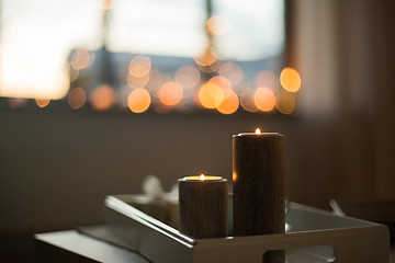 Image showing close up of candles on table at home