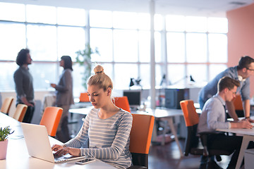 Image showing businesswoman using a laptop in startup office