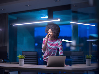 Image showing black businesswoman using a laptop in startup office