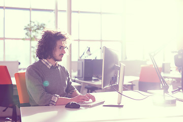 Image showing businessman working using a computer in startup office