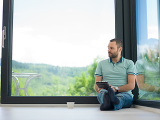 Image showing man on the floor enjoying relaxing lifestyle