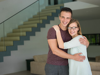 Image showing couple hugging in their new home