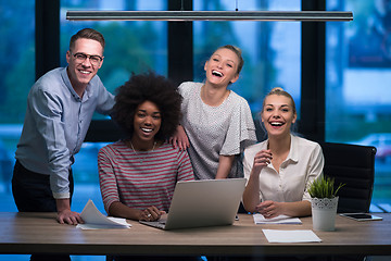 Image showing Multiethnic startup business team in night office