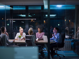 Image showing Multiethnic startup business team in night office