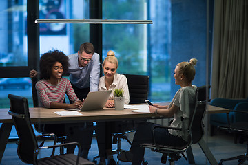 Image showing Multiethnic startup business team in night office