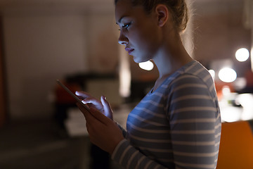 Image showing woman working on digital tablet in night office