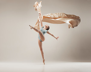 Image showing Modern ballet dancer dancing in full body on white studio background.