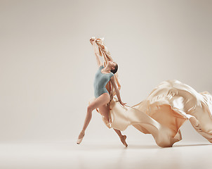 Image showing Modern ballet dancer dancing in full body on white studio background.